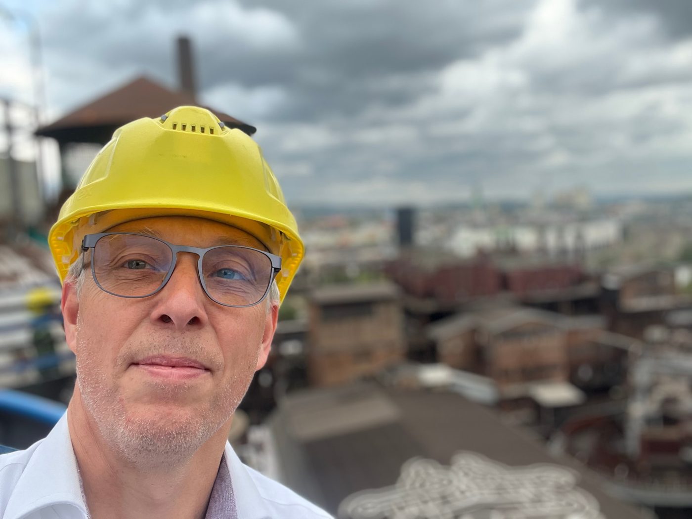 Marnix on a plant site wearing a hard hat
